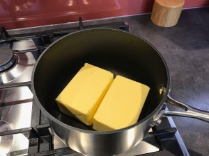 Two blocks of unsalted butter in a saucepan