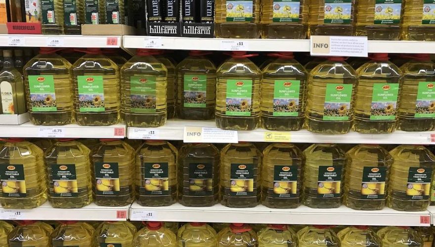 Supermarket shelf full of vegetable oil